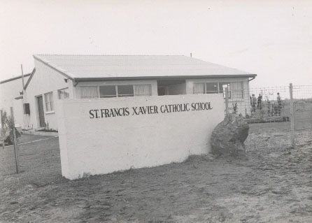 Historic building of St Francis Xavier Catholic School showing early campus development and the foundation of the school community